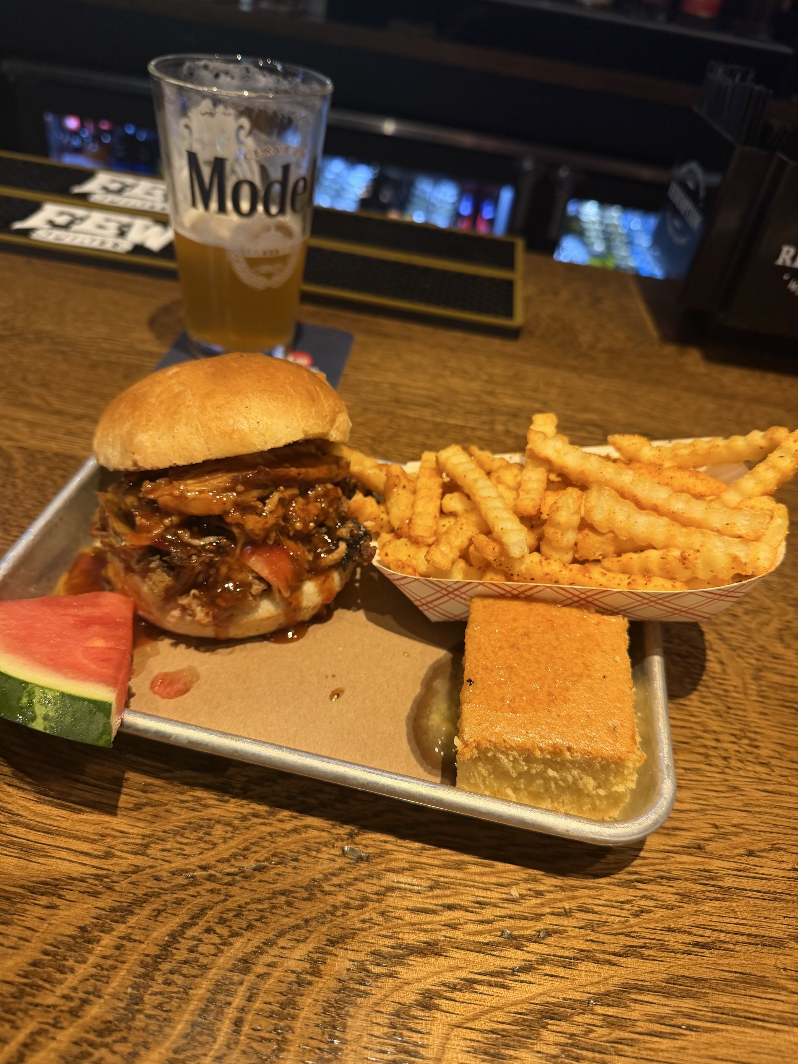 Pulled pork sangy, crinkle cut fries, corn bread, watermelon, Maine Lunch